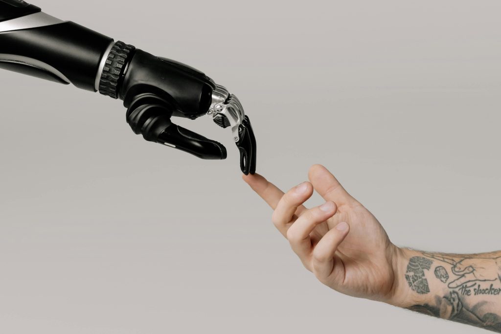 robotic hand touching human hand